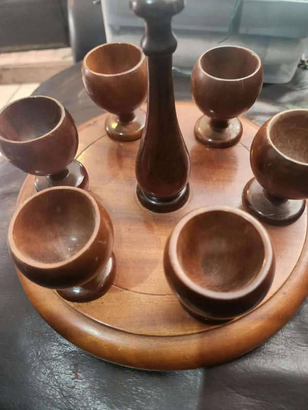 Wooden egg cups with holder. All pins intact