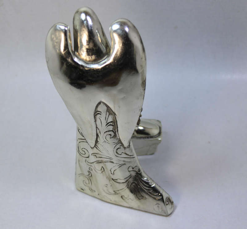 Figurine Of The Angel Gabriel Looking Over Baby Jesus In The Manger