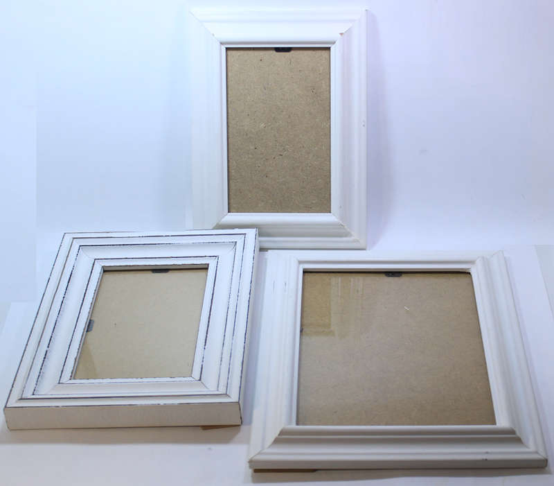 Three Various Sized White Photo Frames With Stands