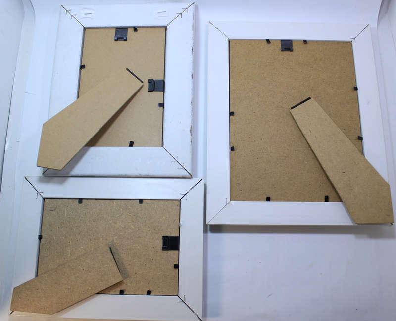 Three Various Sized White Photo Frames With Stands