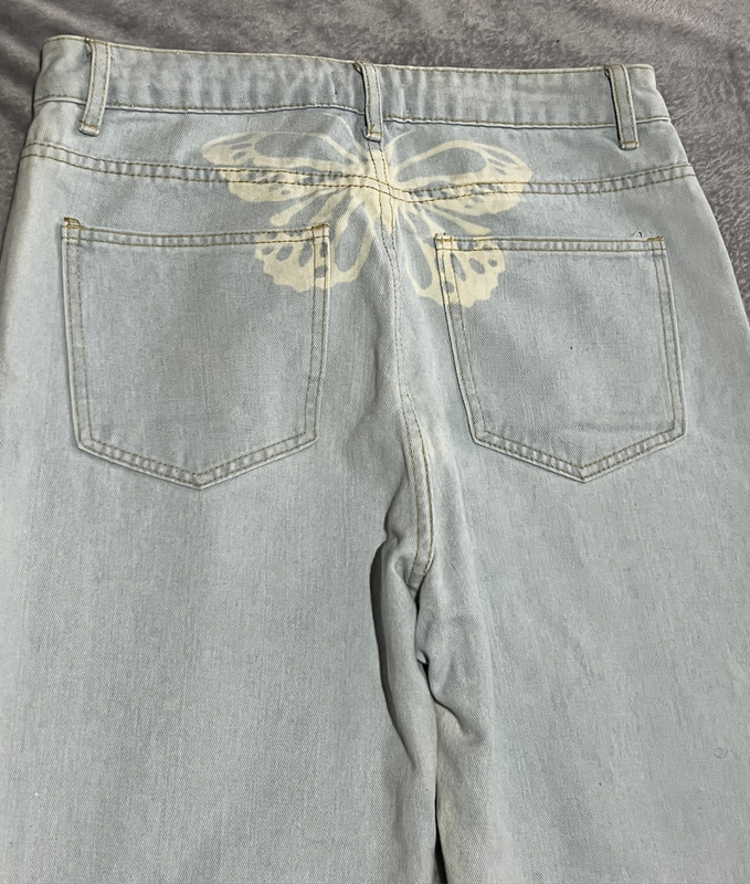 Light Blue Wash Denim jeans with butterfly print on the back