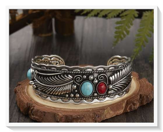 A Beautiful Boho Metal Bangle with Silver and Gold Overtones and Feather Patterns for Him or Her