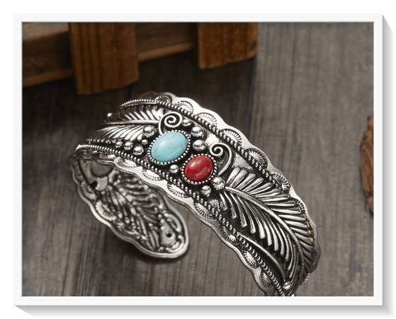 A Beautiful Boho Metal Bangle with Silver and Gold Overtones and Feather Patterns for Him or Her