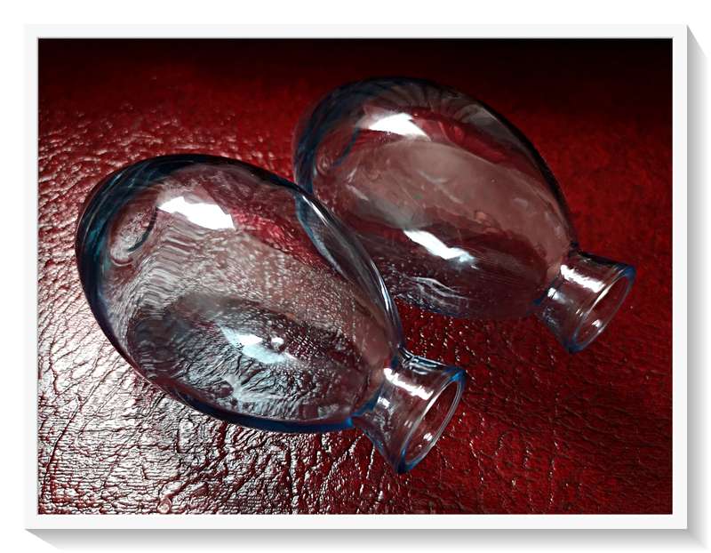 A Pair of clear blue glass bottles - Dimensions: 12cm by 7cm - Condition: New