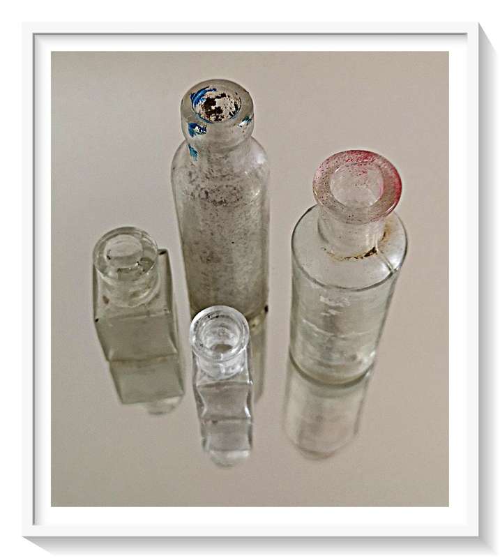 Four Old Clear Glass Yesteryear Bottles - Two Front Bottles are Tiny but Thick Glass