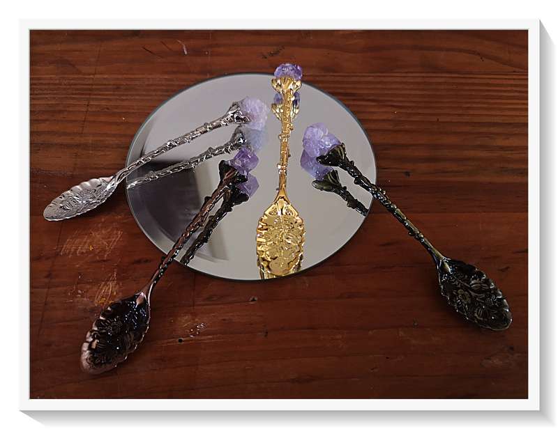 Four different Coloured Metal Teaspoons Each ending in a Rough Crystal Amethyst