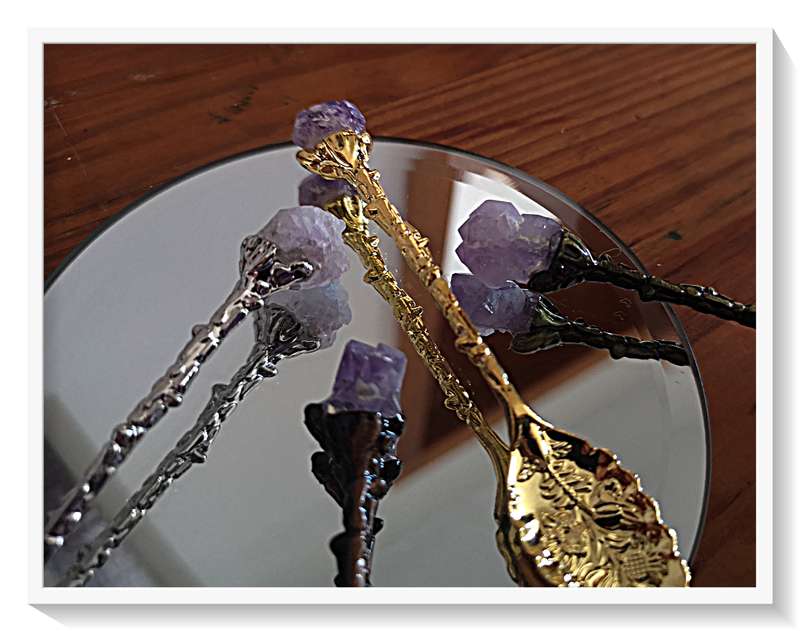 Four different Coloured Metal Teaspoons Each ending in a Rough Crystal Amethyst