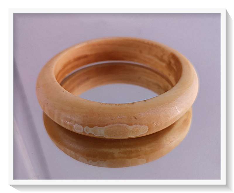 Three Ivory Toned Bangles made from Horn and Wood and Polished Resin
