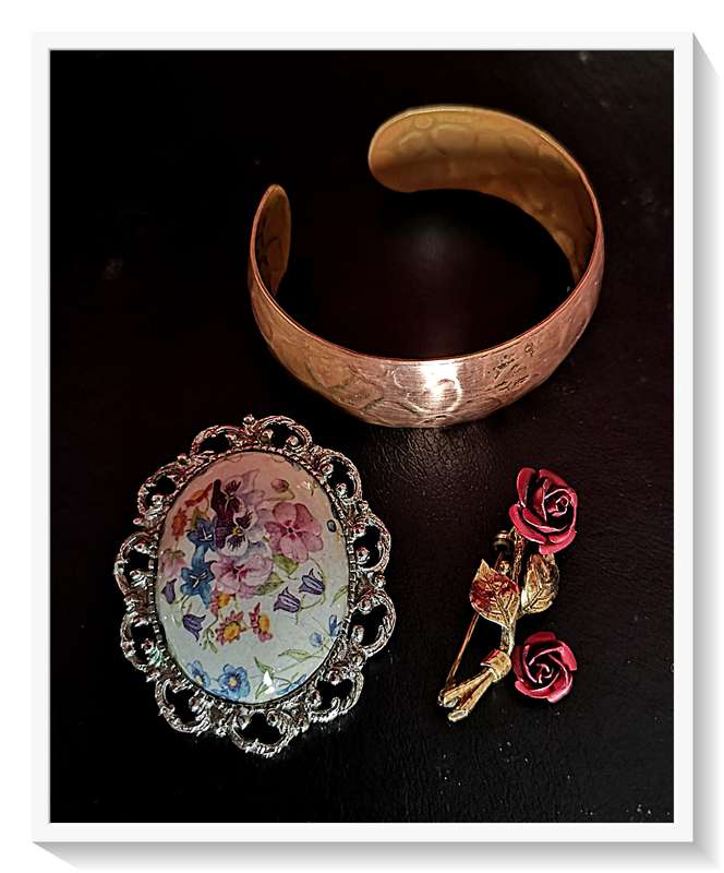 Vintage Trio including a Copper Bangle a Crimson Metal Rose Brooch and a Domed Floral Brooch