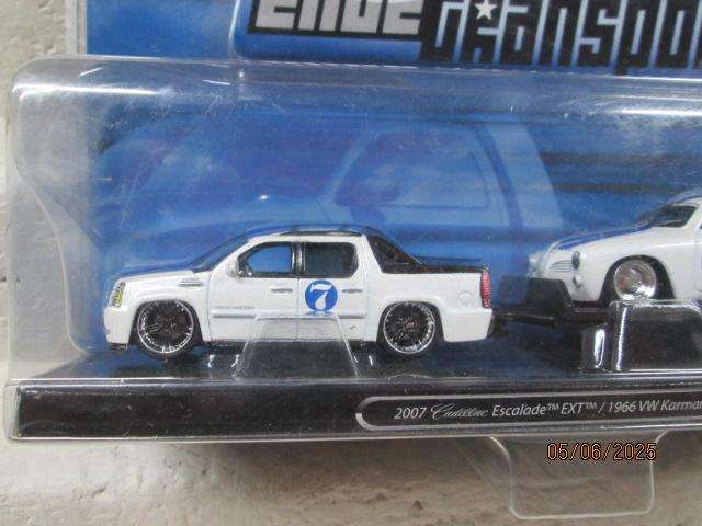 DIE CAST - MAISTO - 2007 CADILLAC BAKKIE WITH 1966 VW KARMANN GHIA ON TRAILER - BOXED