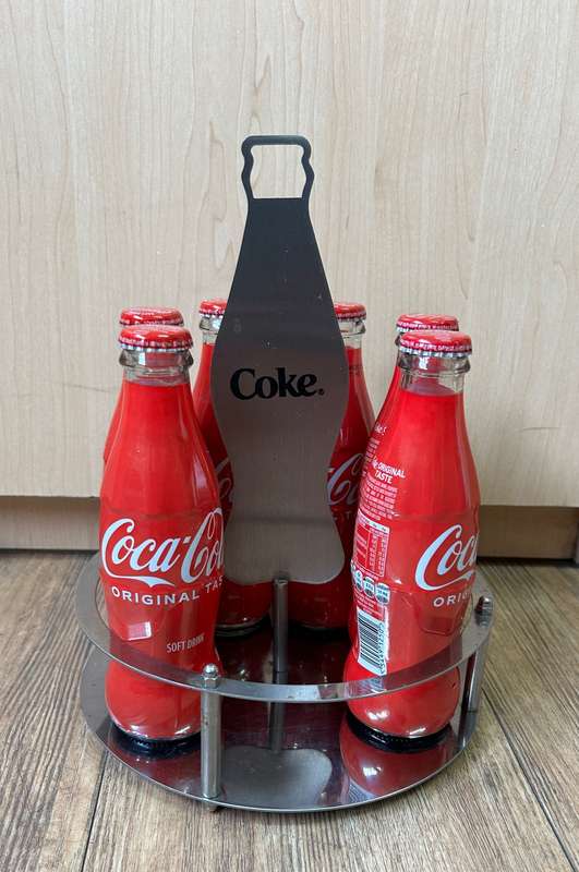 Coca Cola bottles with display unit
