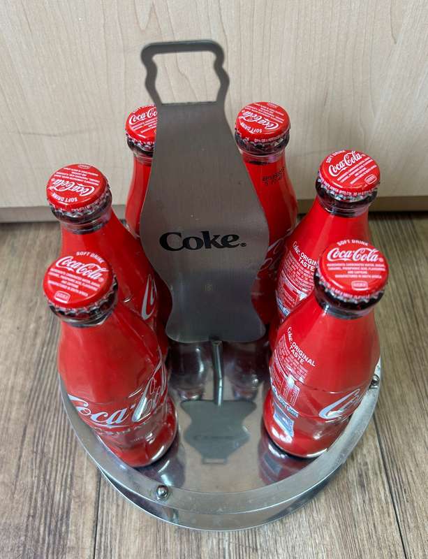 Coca Cola bottles with display unit