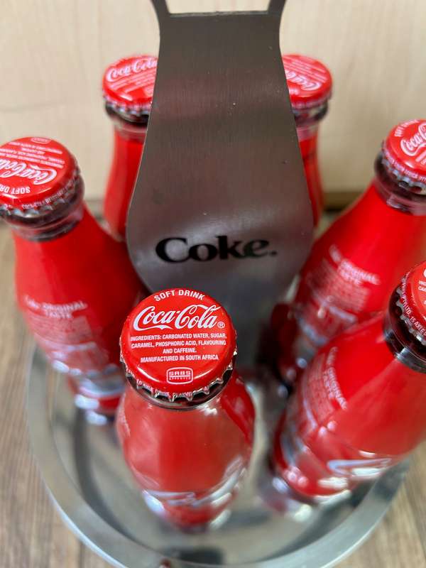 Coca Cola bottles with display unit