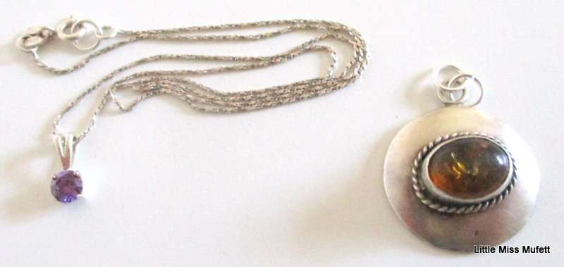 An Amber Sterling silver pendant and a dainty Sterling silver pendant on chain-Total weight  6, 37 g