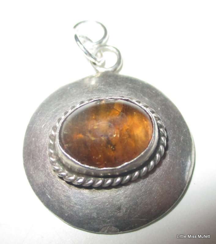 An Amber Sterling silver pendant and a dainty Sterling silver pendant on chain-Total weight  6, 37 g