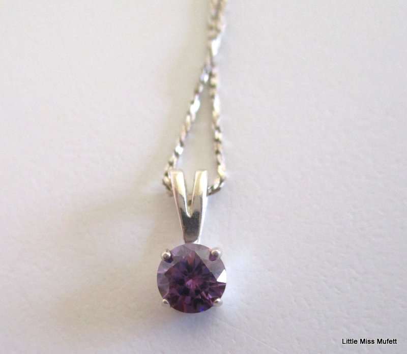 An Amber Sterling silver pendant and a dainty Sterling silver pendant on chain-Total weight  6, 37 g