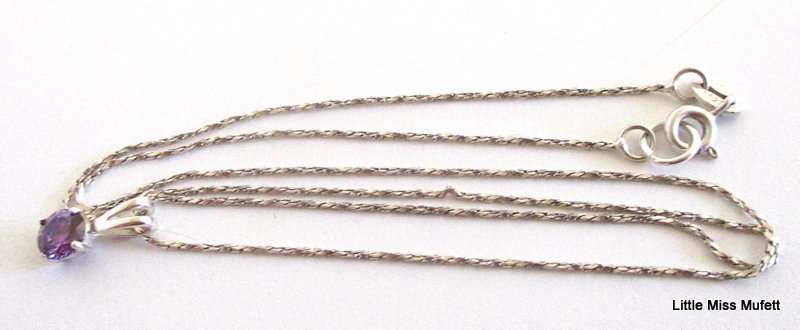 An Amber Sterling silver pendant and a dainty Sterling silver pendant on chain-Total weight  6, 37 g