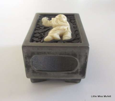 AN interesting Chinese card or cigar box with a matching match box holder