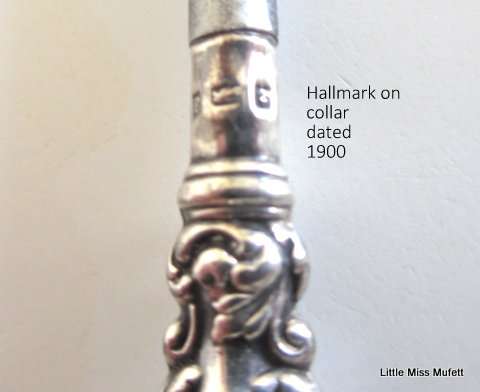 A hallmarked silver button hook