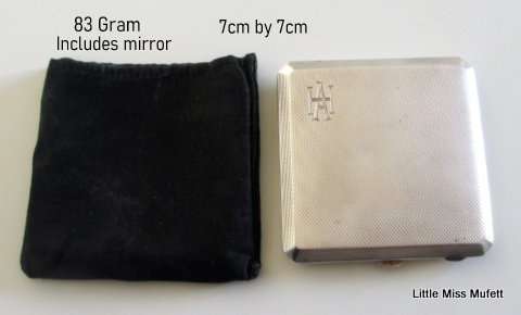 A hallmarked silver powder compact with original powder puff---83 Gram