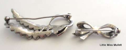 3 Sterling silver items. A Link for a pocket watch chain and 2 marcasite brooches--Total 17 Gram