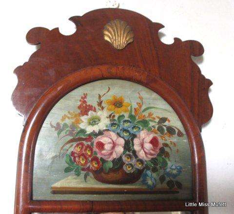A walnut mirror with an oli painting---1920's era