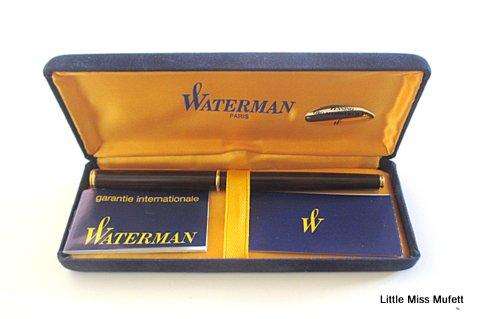 A Waterman fountain pen with an 18ct gold nib  and a full set of cartridges ,with booklets etc