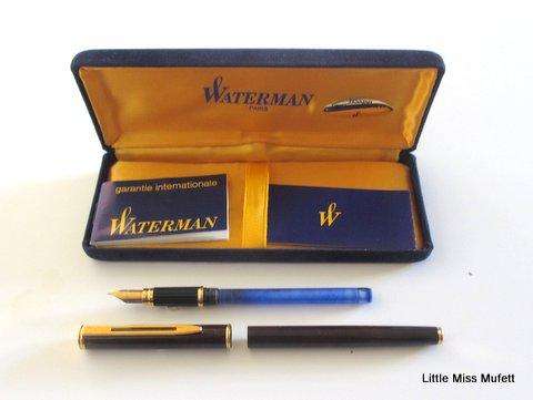 A Waterman fountain pen with an 18ct gold nib  and a full set of cartridges ,with booklets etc