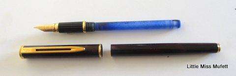 A Waterman fountain pen with an 18ct gold nib  and a full set of cartridges ,with booklets etc