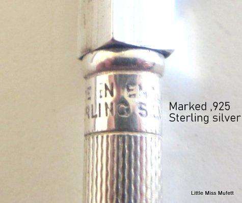 A delightful box of sterling silver bridge pencils