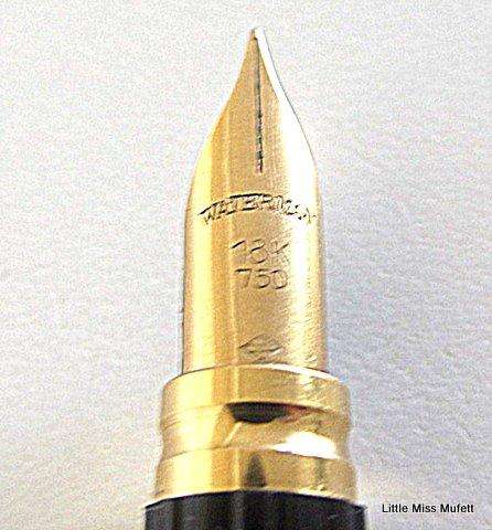 A Waterman fountain pen with an 18ct gold nib  and a full set of cartridges ,with booklets etc