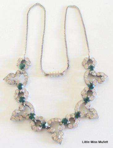 A vintage costume jewellery necklace With green and clear stones