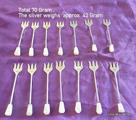 A Set of 14 Hallmarked silver cocktail forks--1935 and 1936