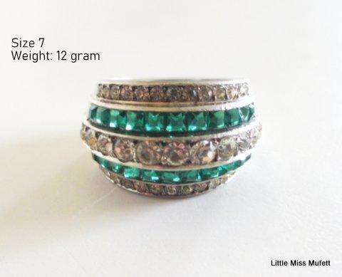 A WIDE STERLING SILVER RING WITH GREEN AND CLEAR STONES--Probably custom made