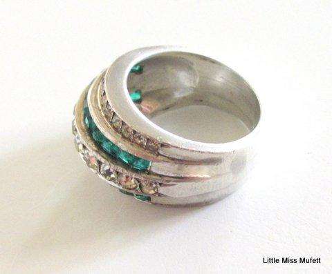 A WIDE STERLING SILVER RING WITH GREEN AND CLEAR STONES--Probably custom made
