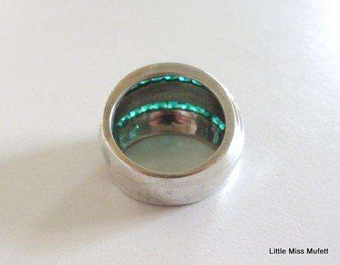 A WIDE STERLING SILVER RING WITH GREEN AND CLEAR STONES--Probably custom made