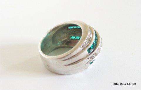 A WIDE STERLING SILVER RING WITH GREEN AND CLEAR STONES--Probably custom made