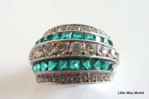 A WIDE STERLING SILVER RING WITH GREEN AND CLEAR STONES--Probably custom made