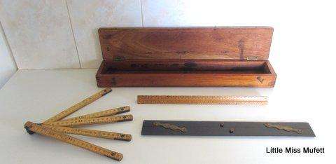 A Well made toolbox with 3 measuring tools