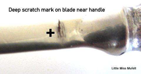A Letter opener with a sterling silver handle in a leather cover.--Please read description