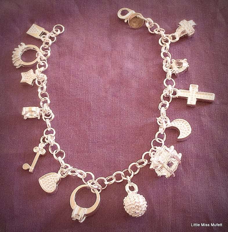 A SILVER PLATED CHARM BRACELET ---NEW