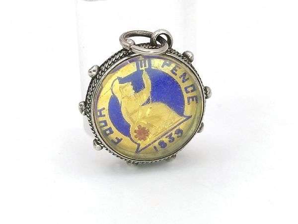 Victorian enamel coin pendant set in sterling silver