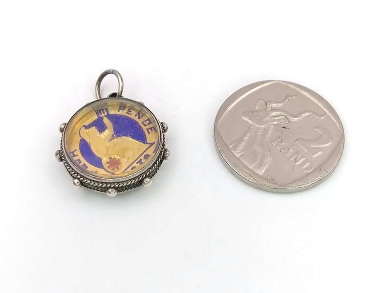 Victorian enamel coin pendant set in sterling silver