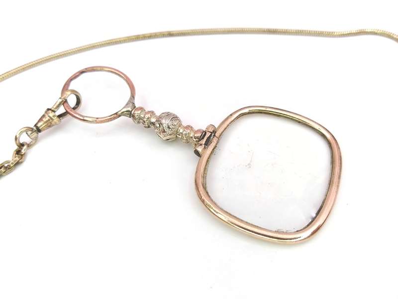 Antique gold plated quizzing glass on chain