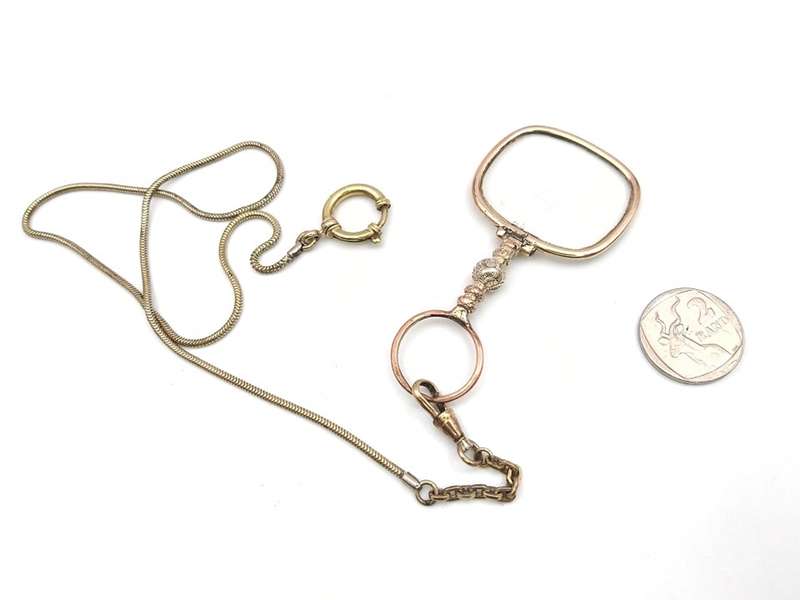 Antique gold plated quizzing glass on chain