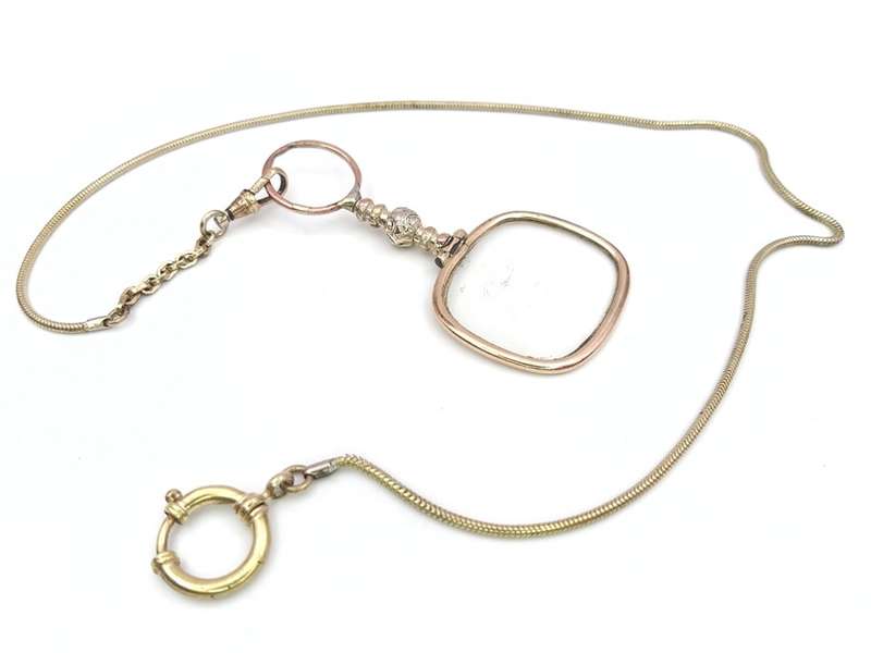Antique gold plated quizzing glass on chain