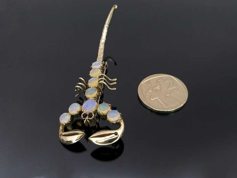 Unusual sterling silver & moonstone scorpion brooch with garnet eyes