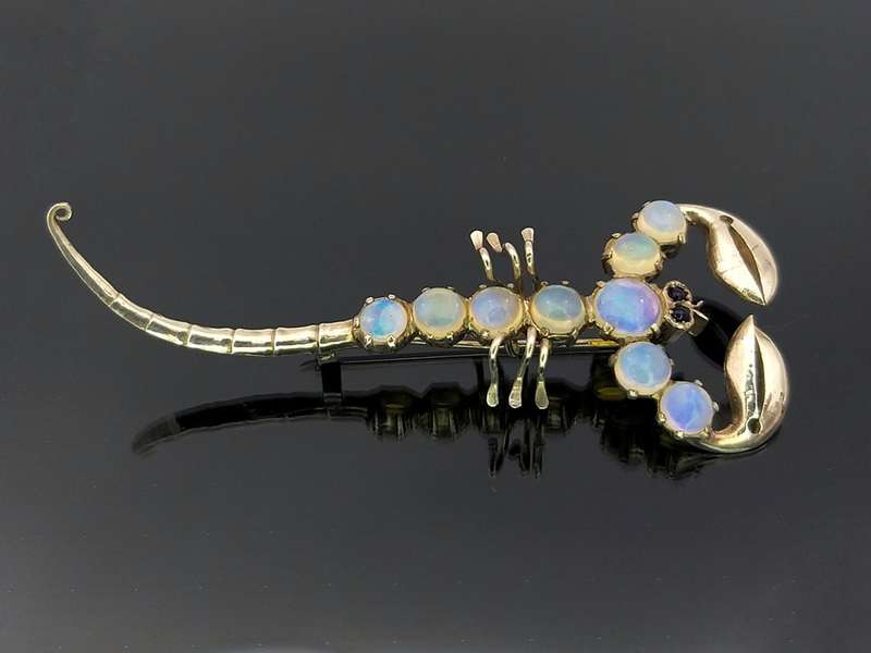 Unusual sterling silver & moonstone scorpion brooch with garnet eyes