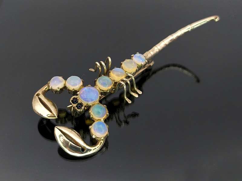 Unusual sterling silver & moonstone scorpion brooch with garnet eyes