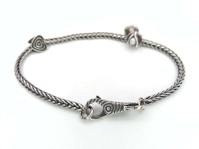 Sterling silver Trollbeads bracelet with two charms